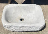 Lavabo de piedra travertino blanco.